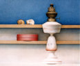 Wim Blom-Two sea shells on a shelf with oil lamp